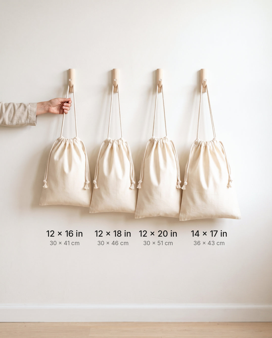 Size comparison of natural muslin drawstring bags: 12×16, 12×18, 12×20 and 14×17 in